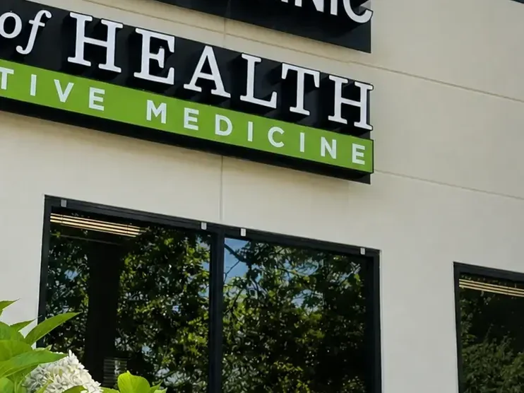 Glass entrance doors under the Tree of Health Integrative Medicine sign in downtown Woodinville
